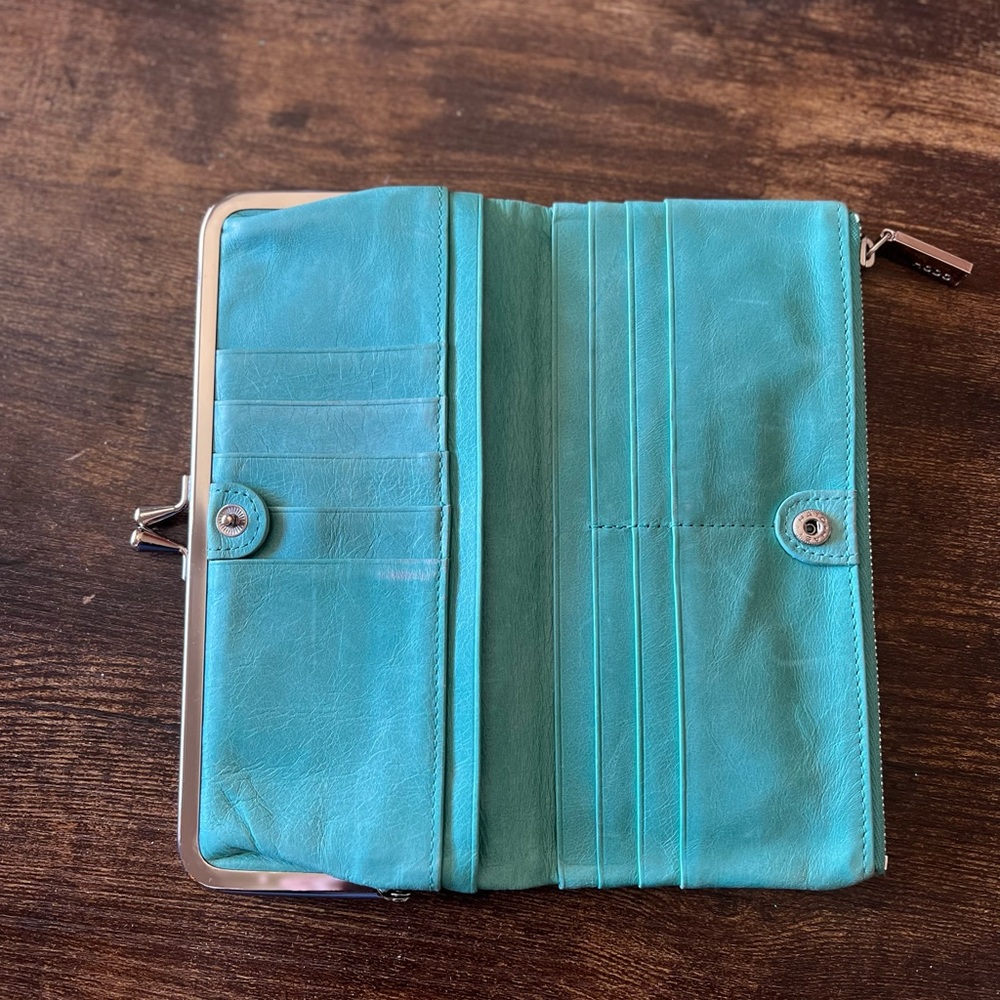 Hobo the original wallet. Leather, turquoise in color. Used condition.